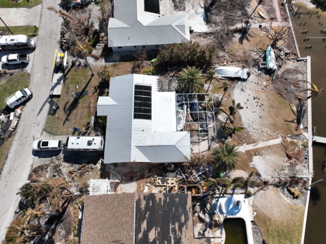 Aerial view of roofs damaged by strong winds