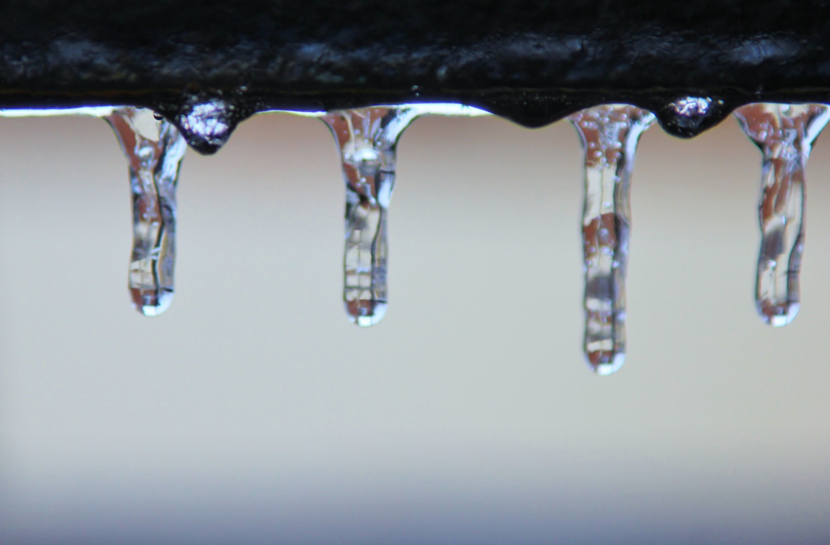 A pipe with frozen drips