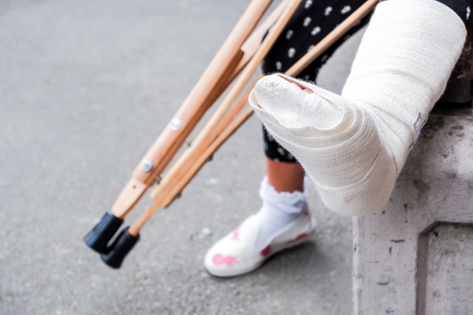 A person in a cast with crutches
